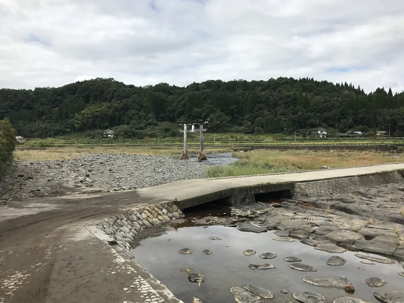 A bridge and shrine torii in the rural Ogata River basin of Oita.