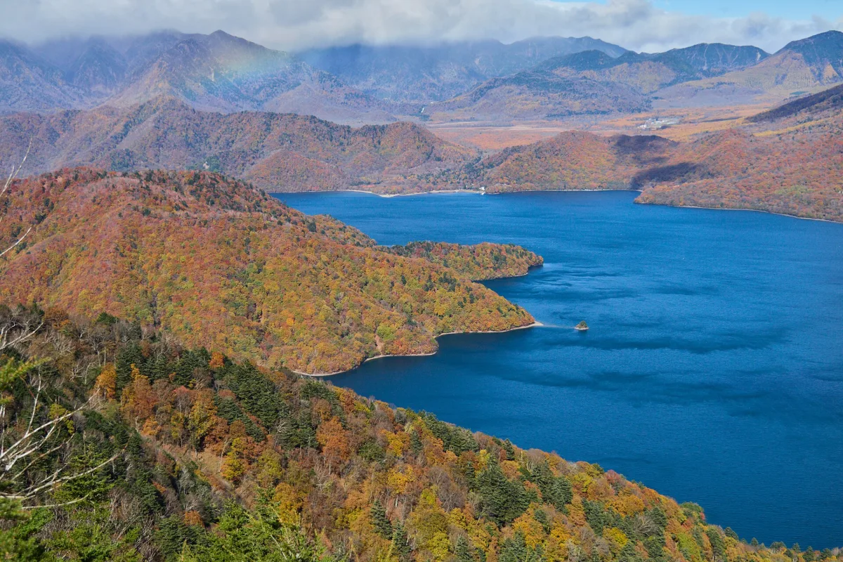 Lake Chuzenji surrounded by autumn foliage, seen from Mount Hangetsu