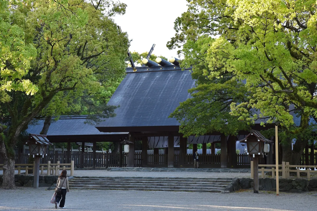 The main hall of Atsuta Jingu in simple wooden shinmei style among tall trees