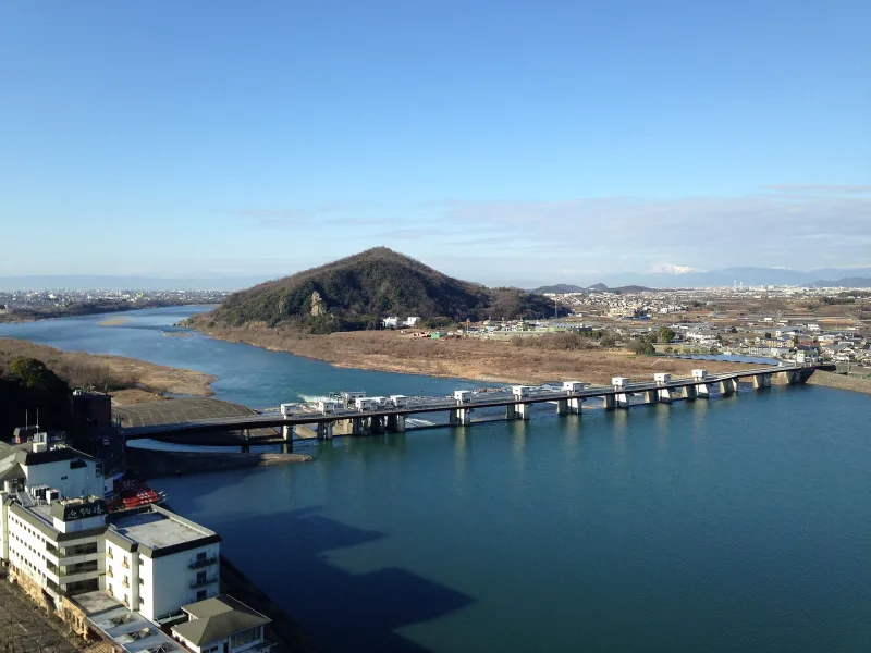 View from the top of Inuyama Castle over the Kiso River, a bridge and Mount Igiyama