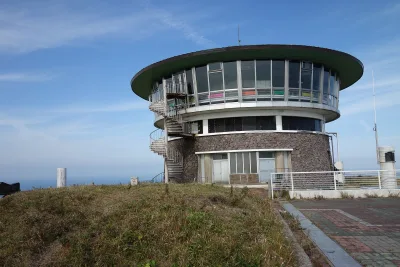 The round rotating observatory on the grassy summit of Mount Kanpu, Oga