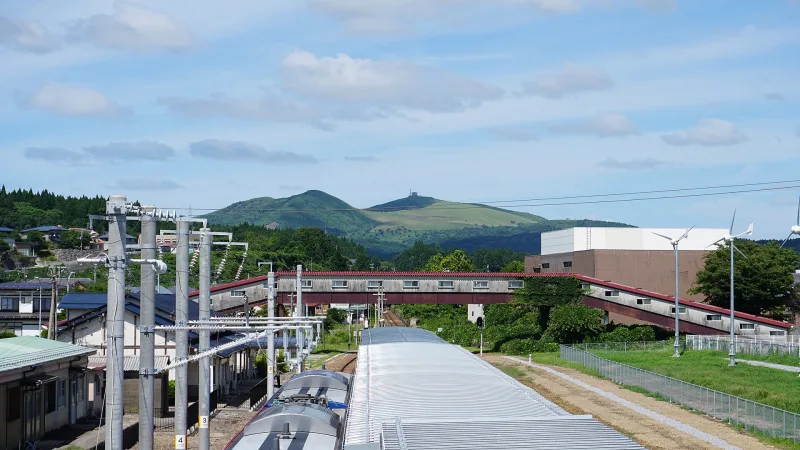 Mount Kanpu rising behind Oga Station and the town