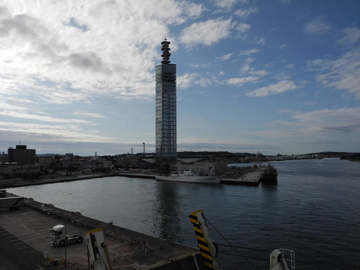 Glass-covered Port Tower Selion rising above the harbor at Akita Port