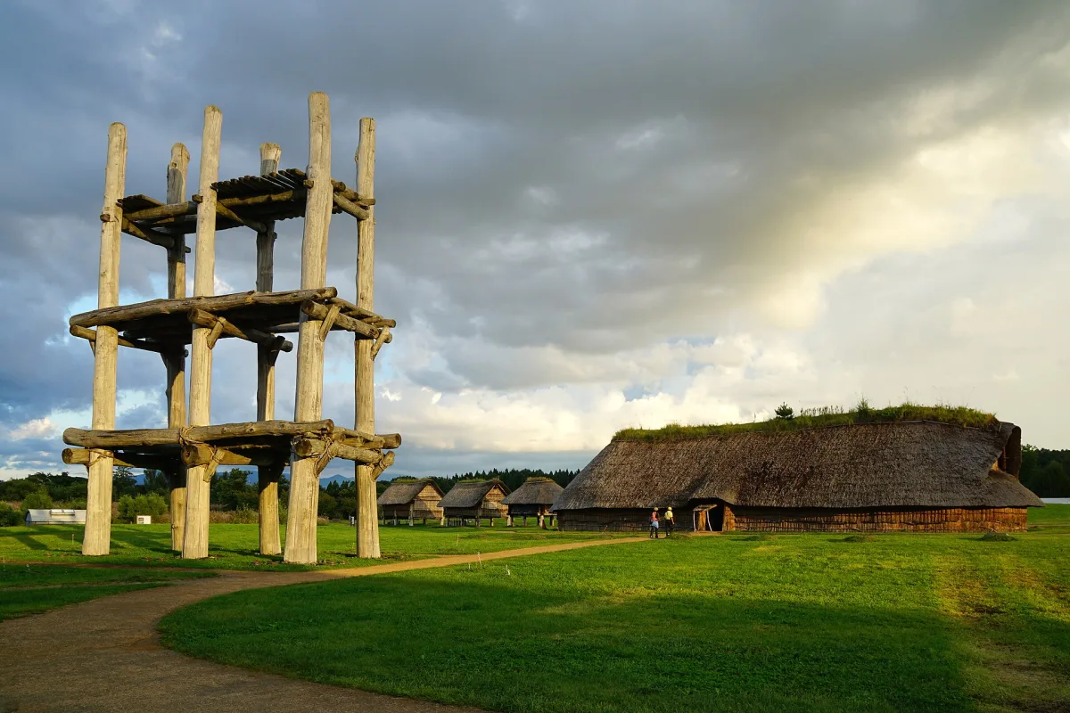 Reconstructed six-pillar wooden tower and large thatched longhouse at the Sannai-Maruyama Jomon site