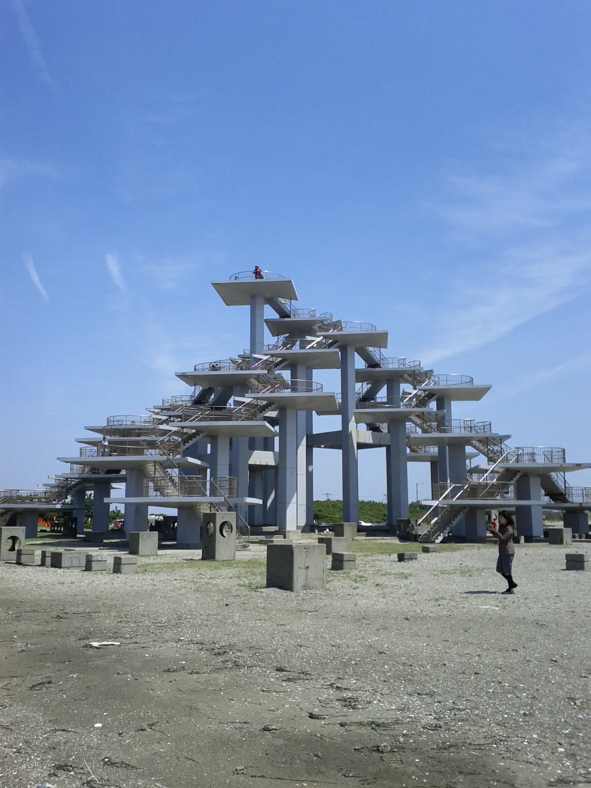 Concrete Meiji Centennial Observation Tower with stacked platforms shaped like a pine tree at Futtsu Cape
