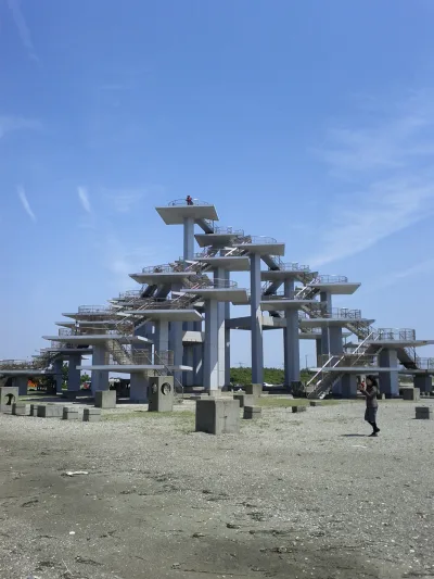 Concrete Meiji Centennial Observation Tower with stacked platforms shaped like a pine tree at Futtsu Cape