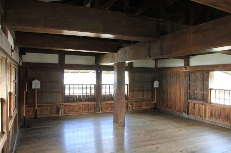 Wooden interior of the Maruoka Castle keep with plank floors and small windows
