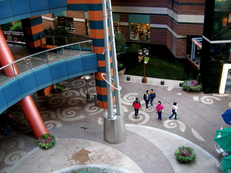 Looking down on Canal City Hakata's patterned plaza, curved walkways and colorful walls