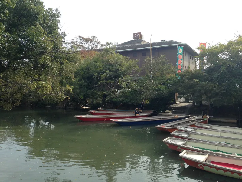 Boats docked at a Yanagawa river tour landing near Ohana Hotel