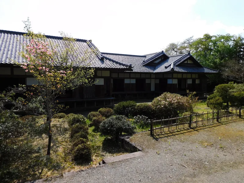 Garden and tiled-roof buildings of the samurai residence at Aizu Bukeyashiki