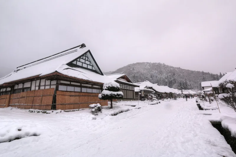 Ouchi-juku's thatched houses and main street covered in snow in winter