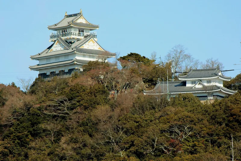 Gifu Castle's white keep rising above the trees on Mount Kinka