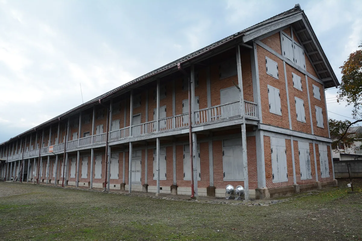 The long two-storey brick West Cocoon Warehouse of Tomioka Silk Mill with wooden balconies