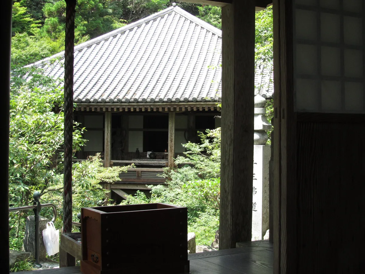 A view of Mitaki-dera Temple in its wooded mountain setting.