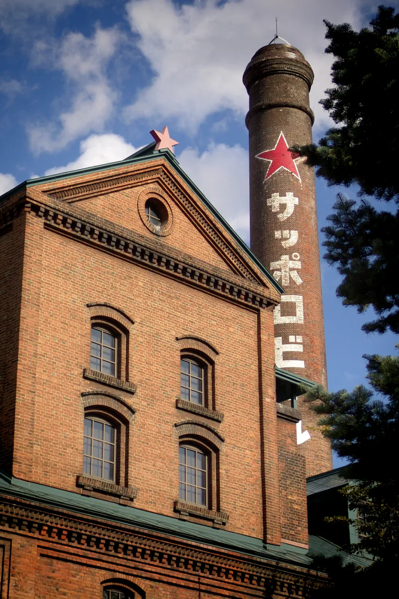 Old wooden beer signboards displayed inside the Sapporo Beer Museum