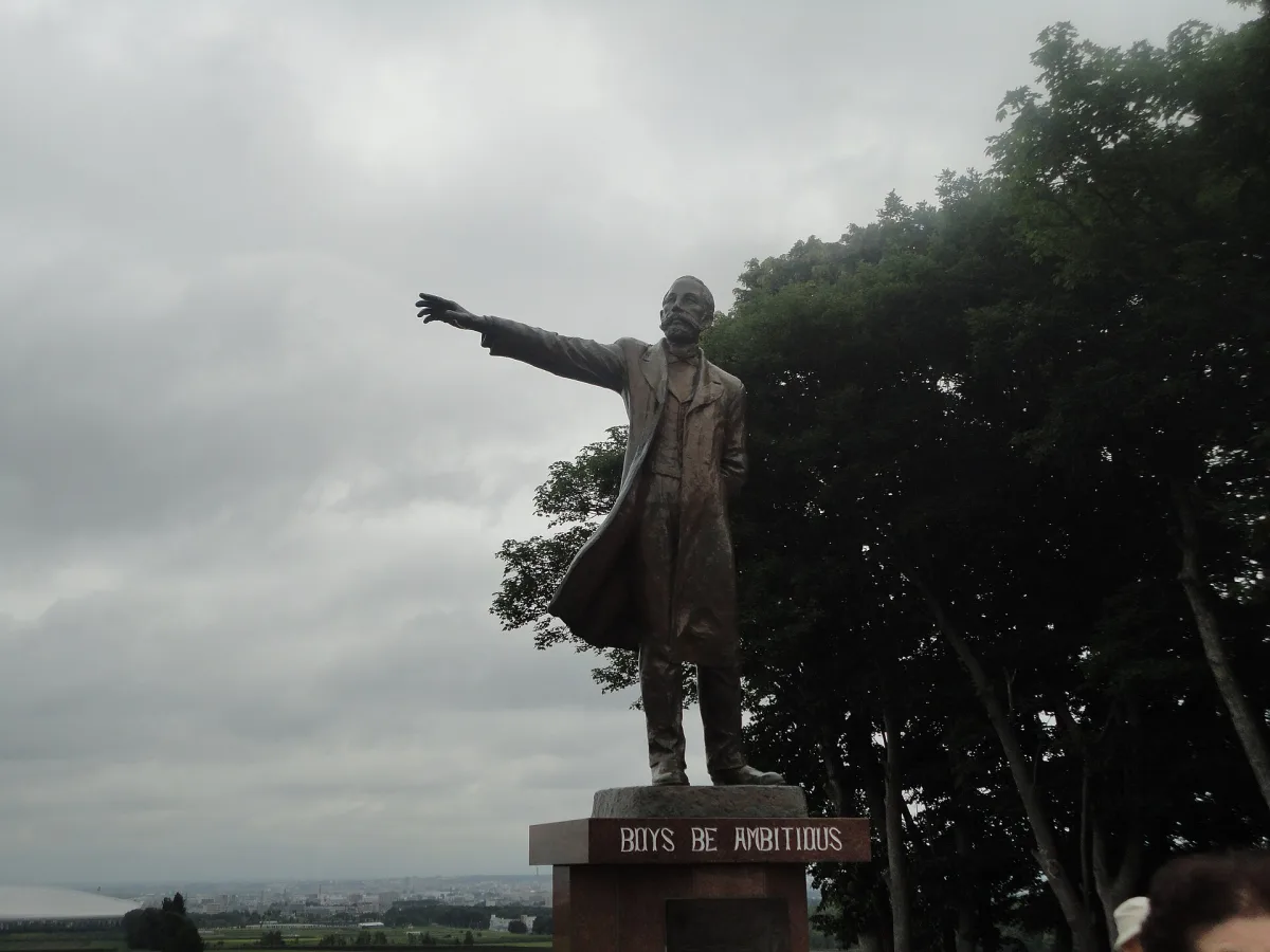 Bronze statue of Dr. William S. Clark pointing into the distance at Hitsujigaoka