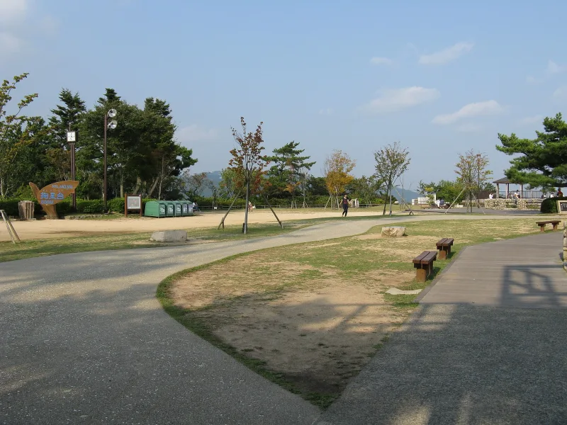 The open plaza of Kikuseidai with paths and benches on Mount Maya