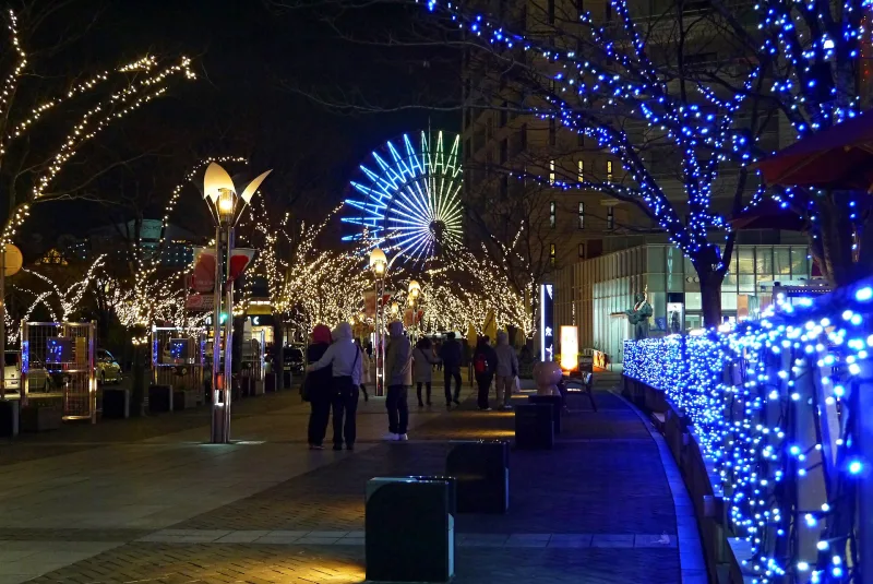 Harborland at night with illuminated trees and the lit-up Ferris wheel