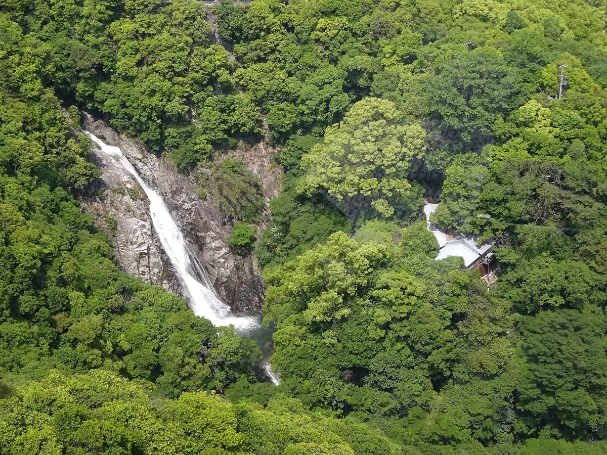 Ontaki waterfall at Nunobiki Falls, surrounded by greenery.