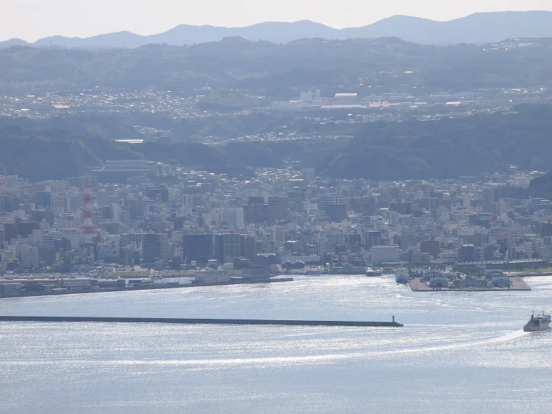 Downtown Kagoshima and the calm waters of Kinko Bay seen from Yunohira Observatory