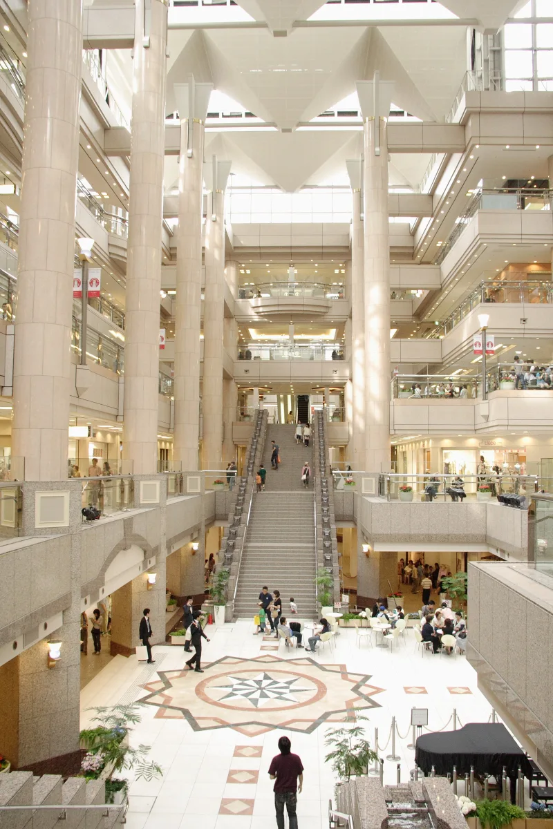 Multi-level atrium of the Landmark Plaza shopping mall inside Yokohama Landmark Tower