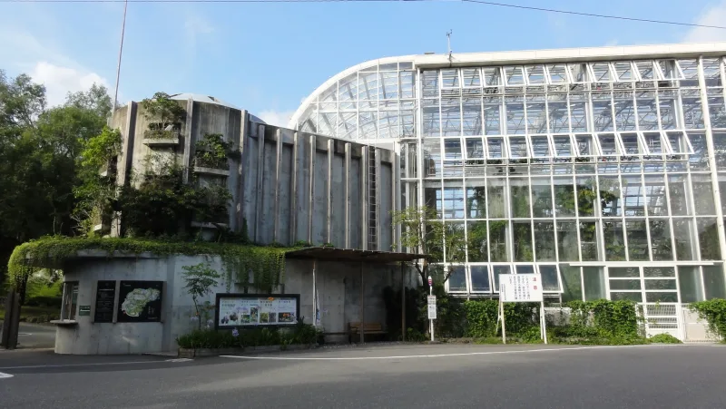 Concrete building and tall glass greenhouse at Makino Botanical Garden