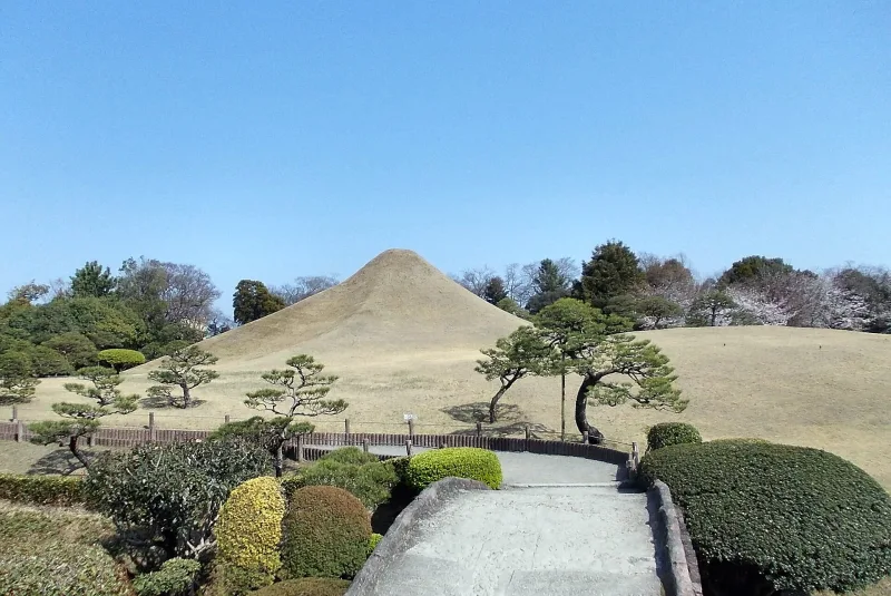 The grassy Fuji-shaped hill and pruned pines in Suizenji Jojuen garden
