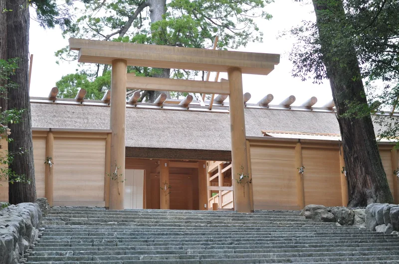 Stone steps up to the plain wooden gate and fence of the main sanctuary at Ise Jingu Naiku