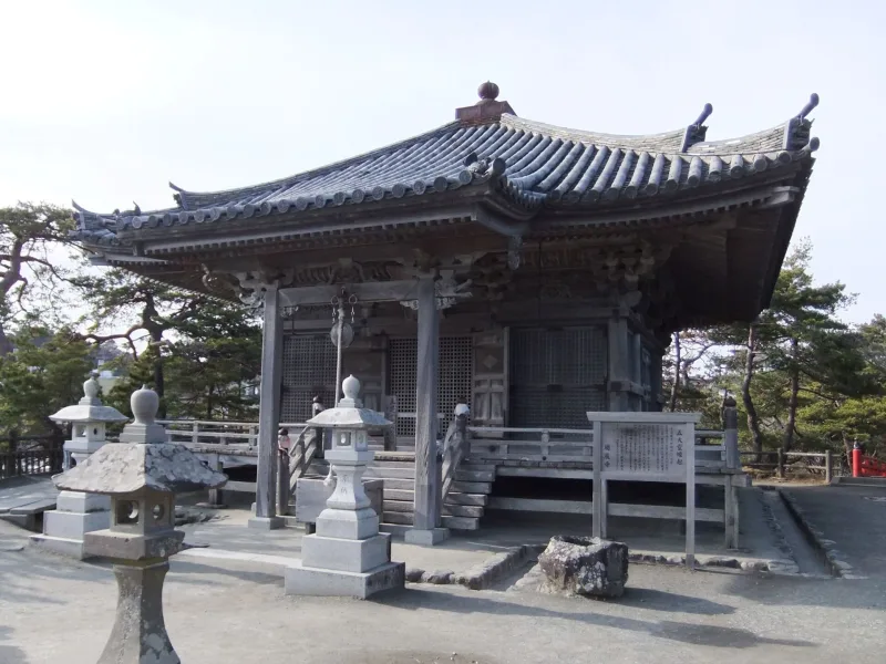 Front of the Godaido hall with stone lanterns on its small island in Matsushima