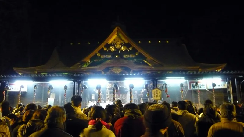 Crowds in front of the lit-up Osaki Hachimangu shrine on Donto-sai festival night