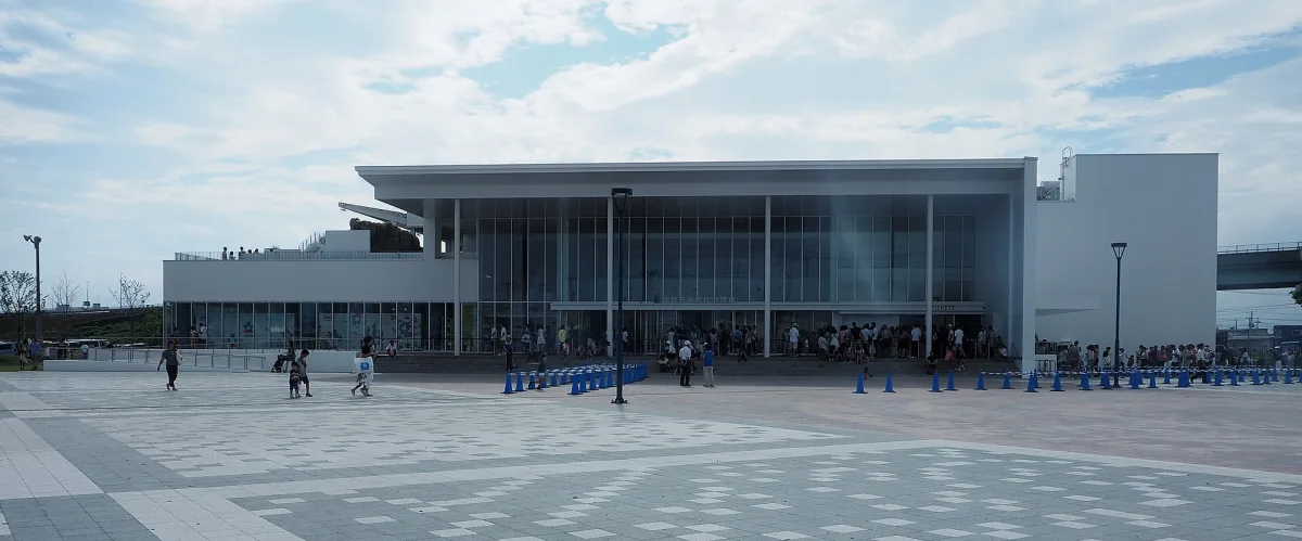 White modern building of the Sendai Umino-Mori Aquarium with a wide plaza in front