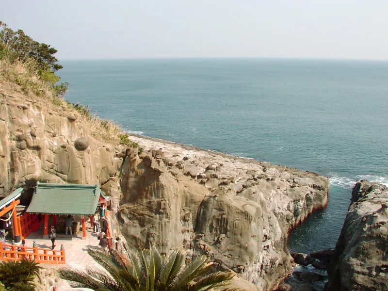 Udo Jingu's shrine buildings on the rocky cliffs above the sea