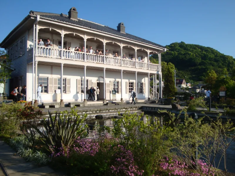 Two-story white Western-style house with long verandas on the hillside at Glover Garden