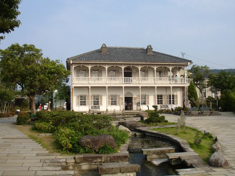 Meiji-era Western-style house with verandas and a garden path at Glover Garden