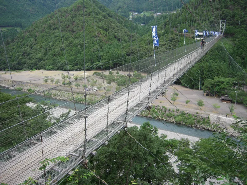 Looking along the narrow Tanize bridge over the riverbed of the Totsukawa River