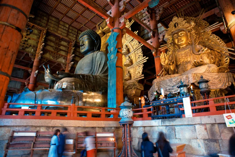 Inside the Great Buddha Hall: the Great Buddha and a golden attendant Buddha statue