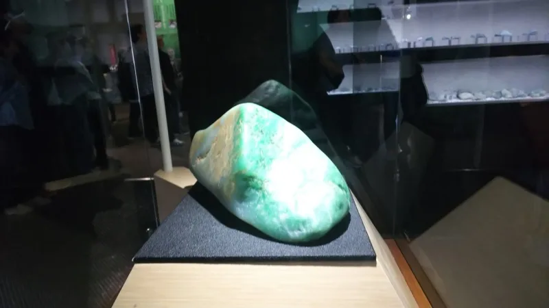A polished green-and-white jade boulder on display at the Fossa Magna Museum