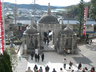 The stone Nio-mon gate of Saijo Inari with domed towers, seen from above