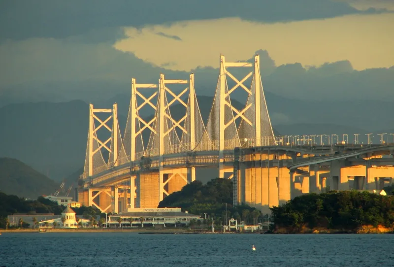 The Great Seto Bridge glowing in evening sunlight, seen from Mount Washu