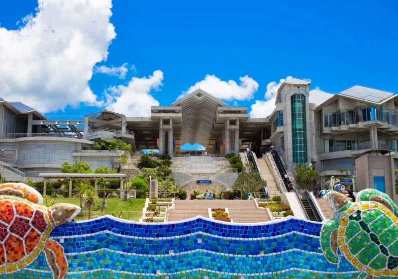 Entrance of Okinawa Churaumi Aquarium with a sea-turtle mosaic fountain
