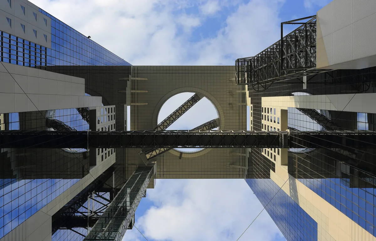 Looking up at the two towers of the Umeda Sky Building joined by the observatory at the top