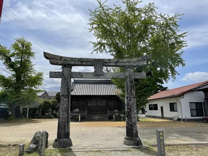 Stone torii gate and small shrine building of Ouo Shrine on the shore