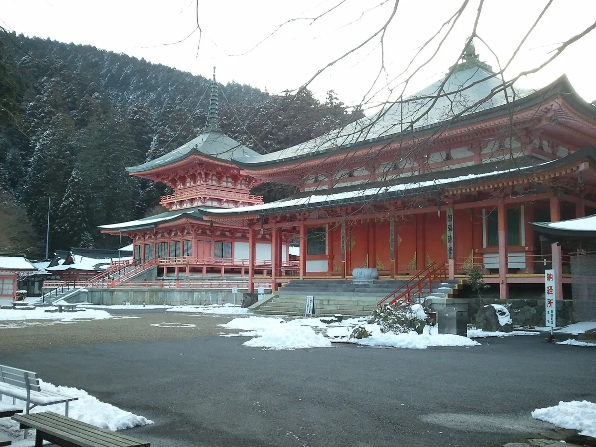 The red Todo pagoda and Amida-do hall of Enryaku-ji on Mount Hiei, with snow on the ground
