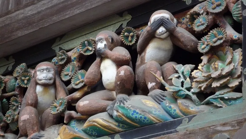 Carving of the three wise monkeys covering their eyes, mouth and ears at Nikko Toshogu