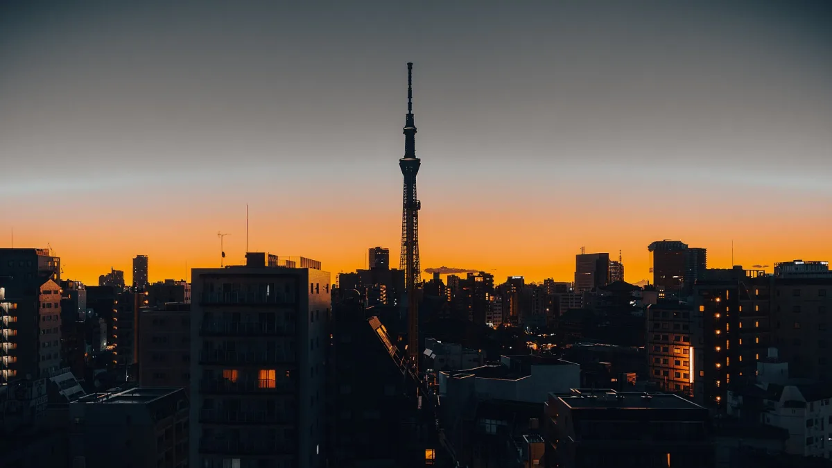 Tokyo Skytree silhouetted above the city skyline at dusk