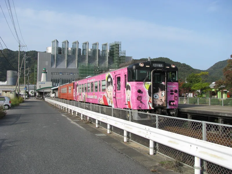 Pink character-wrapped train on the JR Sakai Line at Sakaiminato Station