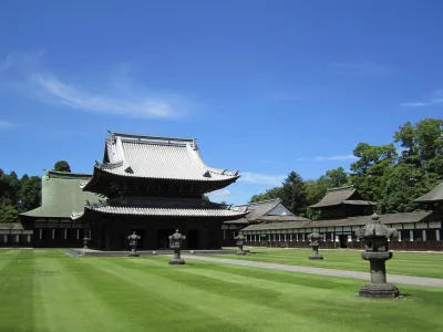 Zuiryuji Temple's Buddha hall and lecture hall beyond a wide lawn in Takaoka