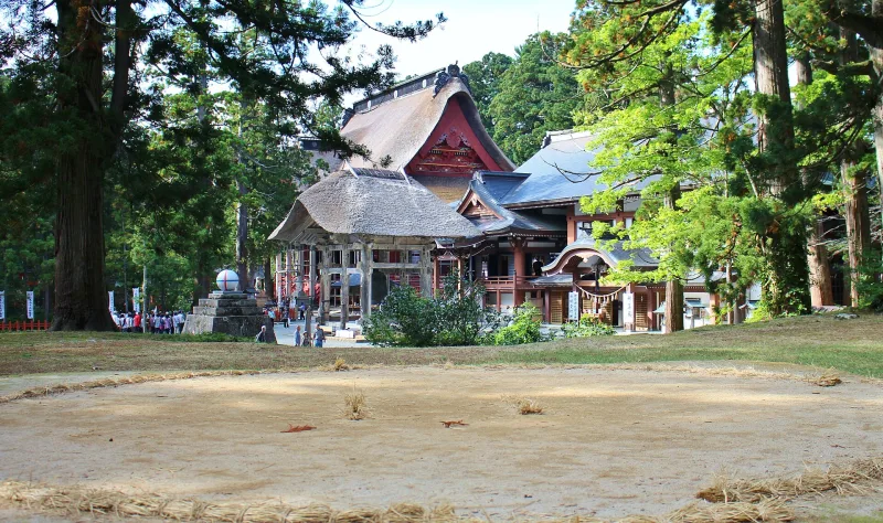 Sanjin Gosaiden and surrounding buildings seen across the summit grounds of Mount Haguro