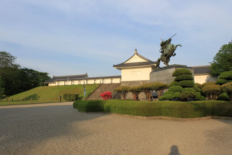 Equestrian statue of the warlord Mogami Yoshiaki in front of the castle gate in Kajo Park