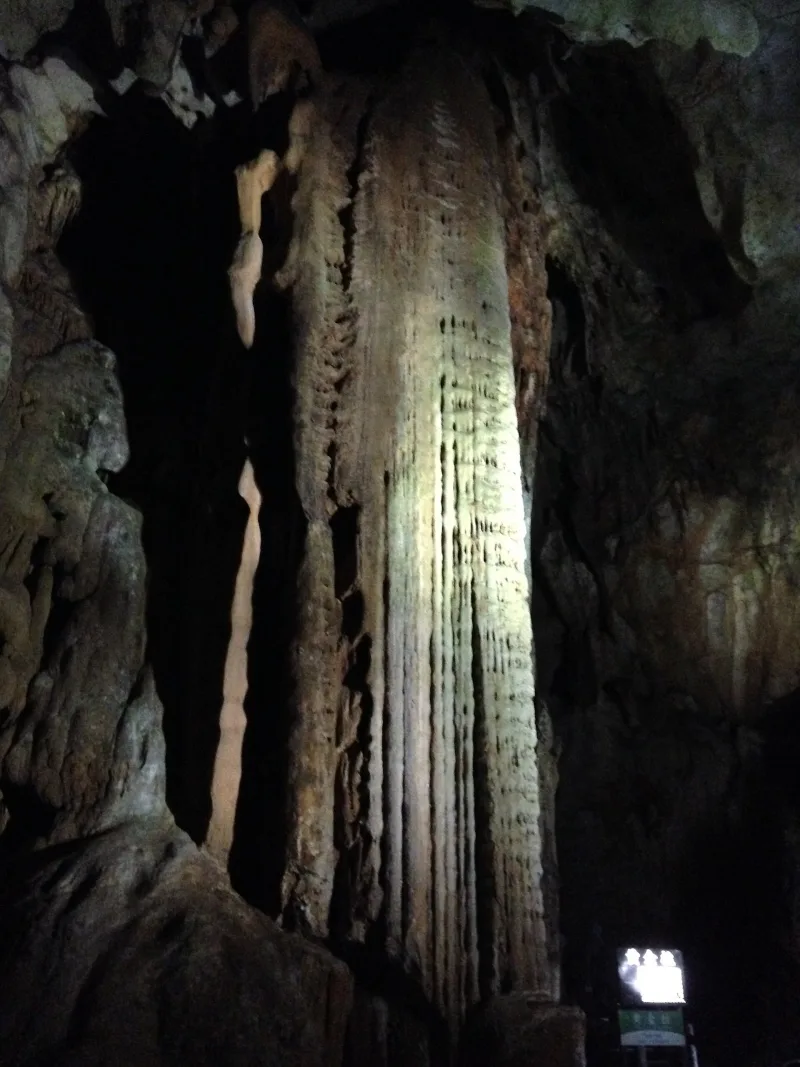 The tall golden-coloured flowstone column called Kogane-bashira inside Akiyoshido Cave